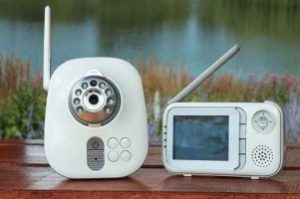 Baby monitor with camera and screen outdoors.