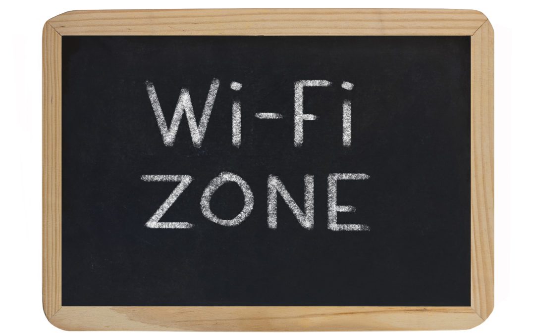 A chalkboard with the words wi-fi zone written on it.